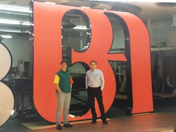 John and his father-in-law Paxton on a sign job for Bank of America